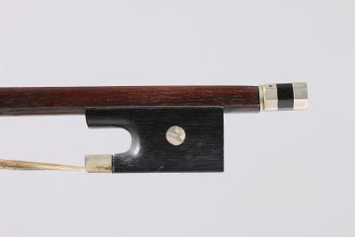 the bow is made of wood and has a silver tip