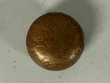 an image of a gold locke on a white surface