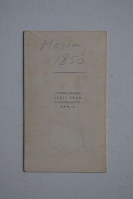an old book with writing on it sitting on a table