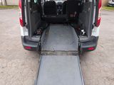 the back of a van with a ramp attached to the back of it
