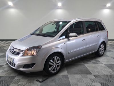 a picture of a silver van parked in a garage