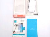 a box with a phone inside of it on a white surface