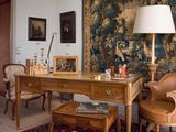 an image of a living room with a large tapestry on the wall