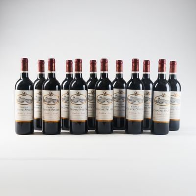 six bottles of red wine lined up in a row