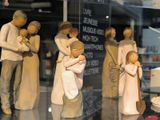 many figurines of people in a display case