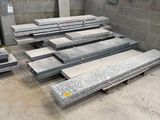 many pieces of granite on the ground in a room