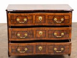 an image of a chest of drawers on a wooden floor