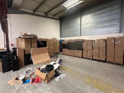 a room with a lot of boxes and boxes on the floor