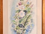 painting of a bird and flowers in a wooden frame on a wall