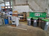 a lot of trash cans and trash cans in a warehouse