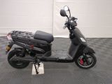 a scooter that is parked in a garage