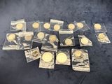 some of the gold coins are in plastic bags on a table