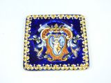 a blue and gold plate with a picture on it