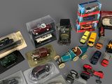a lot of toy cars that are sitting on a table