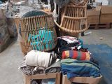 a pile of clothes on a cart in a warehouse