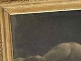 a picture of a painting of a nude laying on a bed