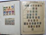an open book with stamps on it on a table