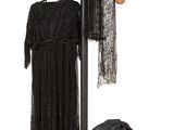 a coat rack with clothes on it and a hat on a stand