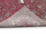an image of a red rug with a white bow on it