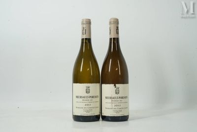 two bottles of wine sitting next to each other on a table