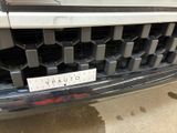 a close up of a car with a sticker on the front of it