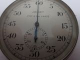 a close up of an old pocket watch with numbers on it