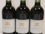 three bottles of wine sitting on top of a white table