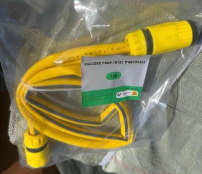 a yellow hose that is in a plastic bag