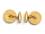 a pair of gold cufflinks with a coin on each side