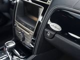 a close up of a car ' s interior with a steering control