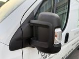 an image of a side view mirror of a van