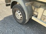 a close up of a flat tire on a semi truck
