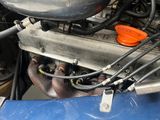 a close up of the engine of a blue car