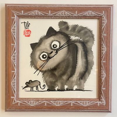 a painting of a cat and a mouse on the wall