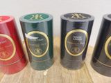 four different colored tins of wine sitting on top of a wooden table