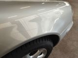 a white car that is parked in a garage