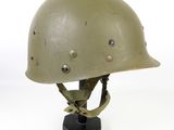 an image of a military helmet on a stand on a white background