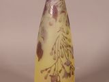 a vase with a yellow and purple design on it