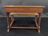an old school desk with a wooden top and legs