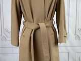 the coat is made of wool and has a belt on the waist
