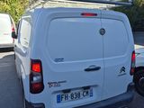a white van that is parked in a parking lot