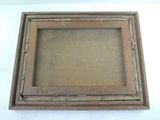 an old picture frame with a wooden frame on a white background