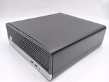 an image of a small black computer on a white surface
