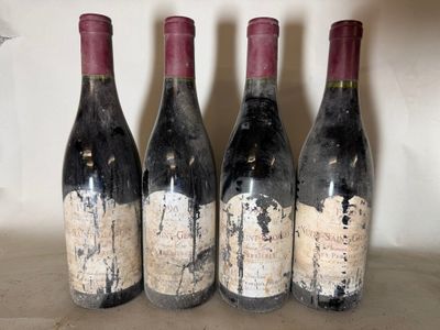 three bottles of wine are lined up on a shelf