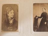 an old photo of a woman and a man standing next to each other