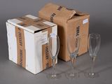 three empty wine glasses in front of a cardboard box