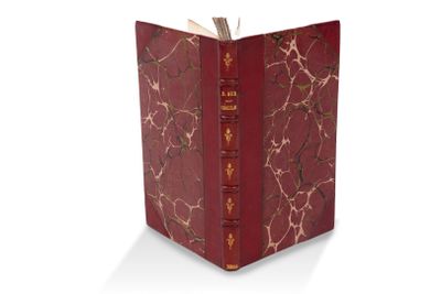 une image représentant un livre rouge orné d'un motif doré
