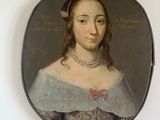 portrait of a woman in a gray dress with a red bow