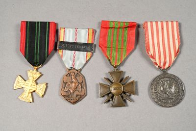 several medals and medals are displayed on a gray surface