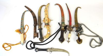 five different types of knives and a pair of scissors on the table